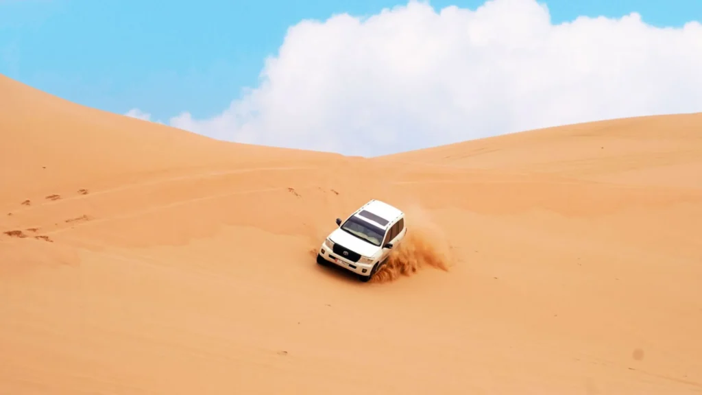 4x4 SUV dune bashing in Al Ain Desert Abu Dhabi, a lesser-known desert safari location.