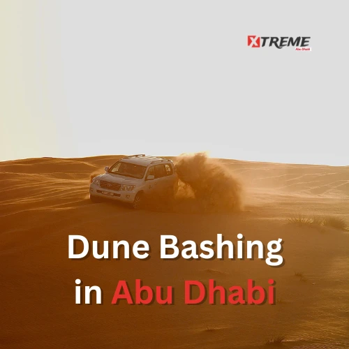 Desert safari dune bashing in Abu Dhabi — Toyota Land Cruiser on red sand dunes at Al Khatim