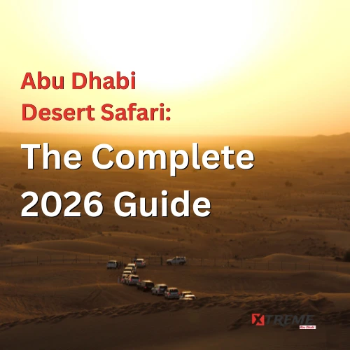 A convoy of white 4x4 SUVs navigating golden sand dunes at sunset during a desert safari in Abu Dhabi, with rolling dunes and a warm amber horizon stretching into the distance.